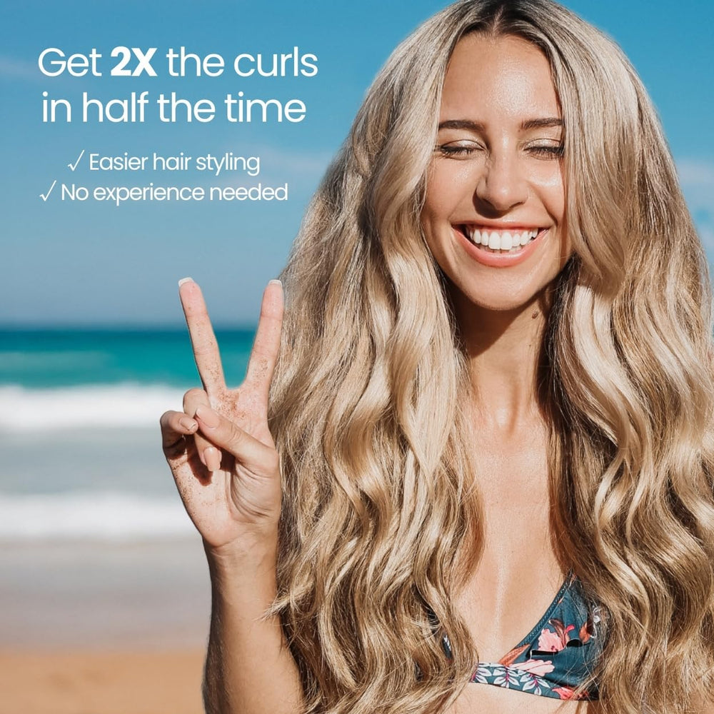 Beachwaver B1 held next to a hand to show 5.5-inch barrel scale and travel-friendly size