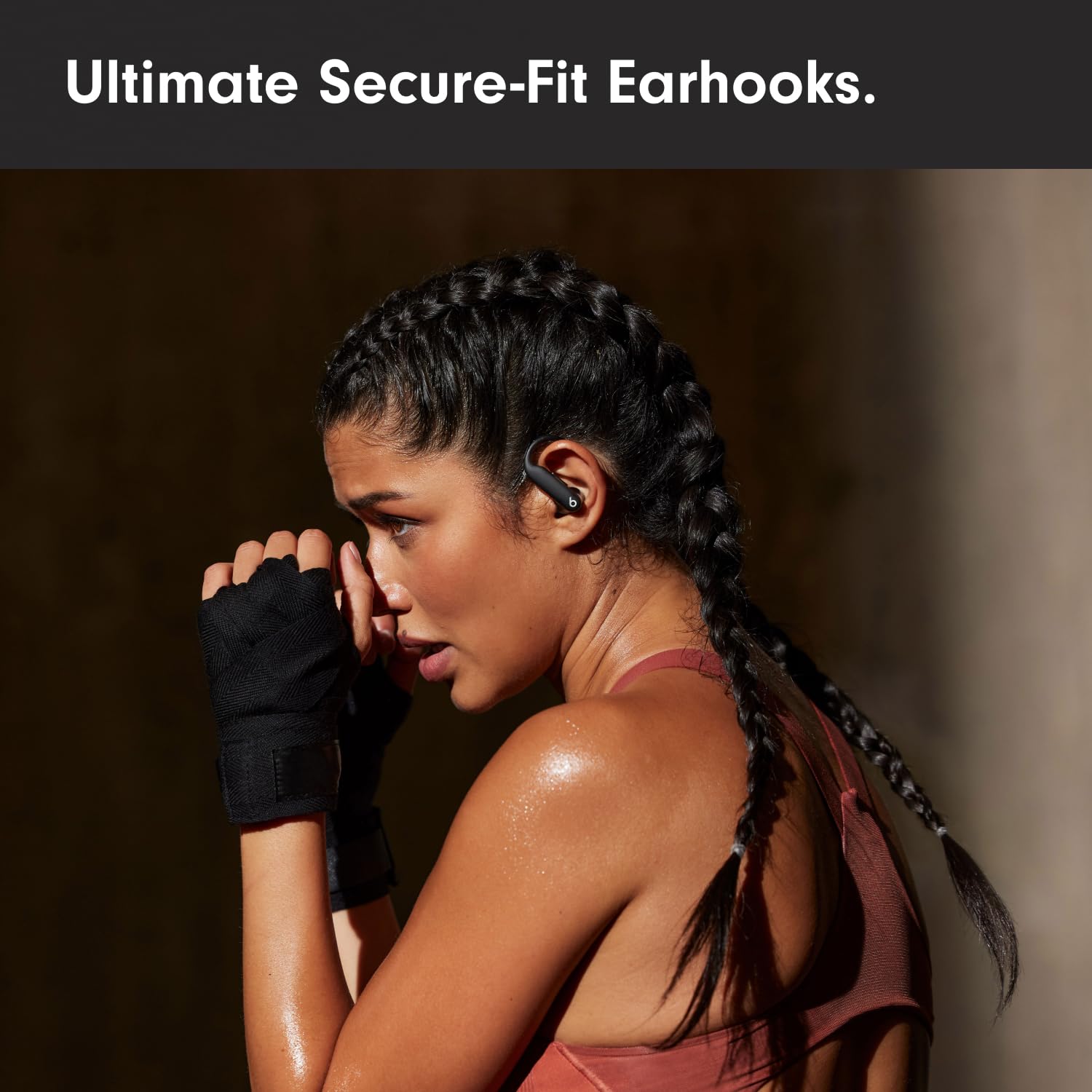Beats Powerbeats Pro 2 worn during workout demonstrating stable fit and hands‑free use