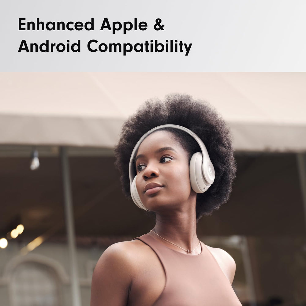 Person wearing Beats Studio Pro on a train illustrating noise isolation and commuting use