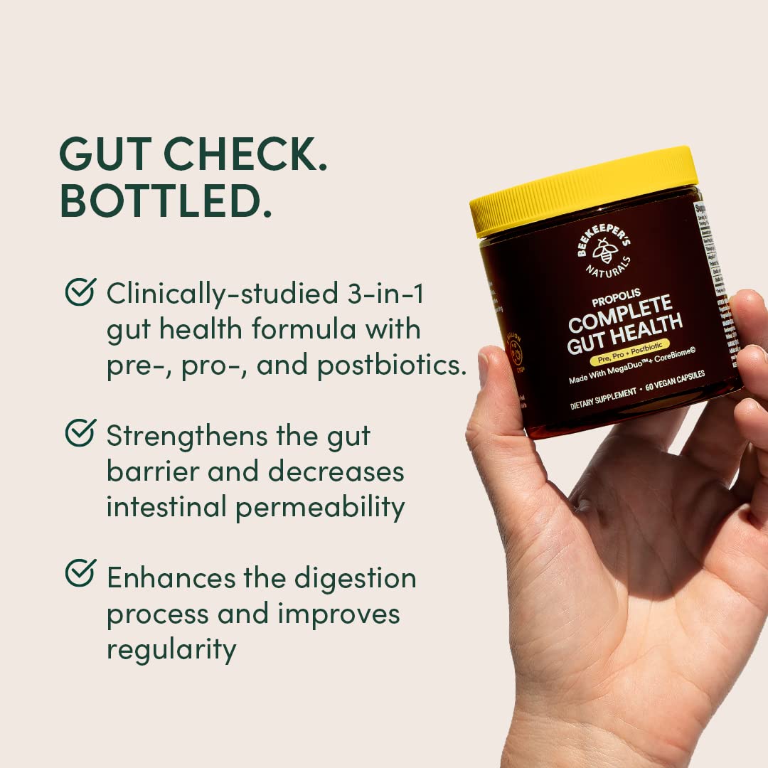 Beekeeper's Naturals cápsula abierta con polvo probiótico que muestra la formulación resistente