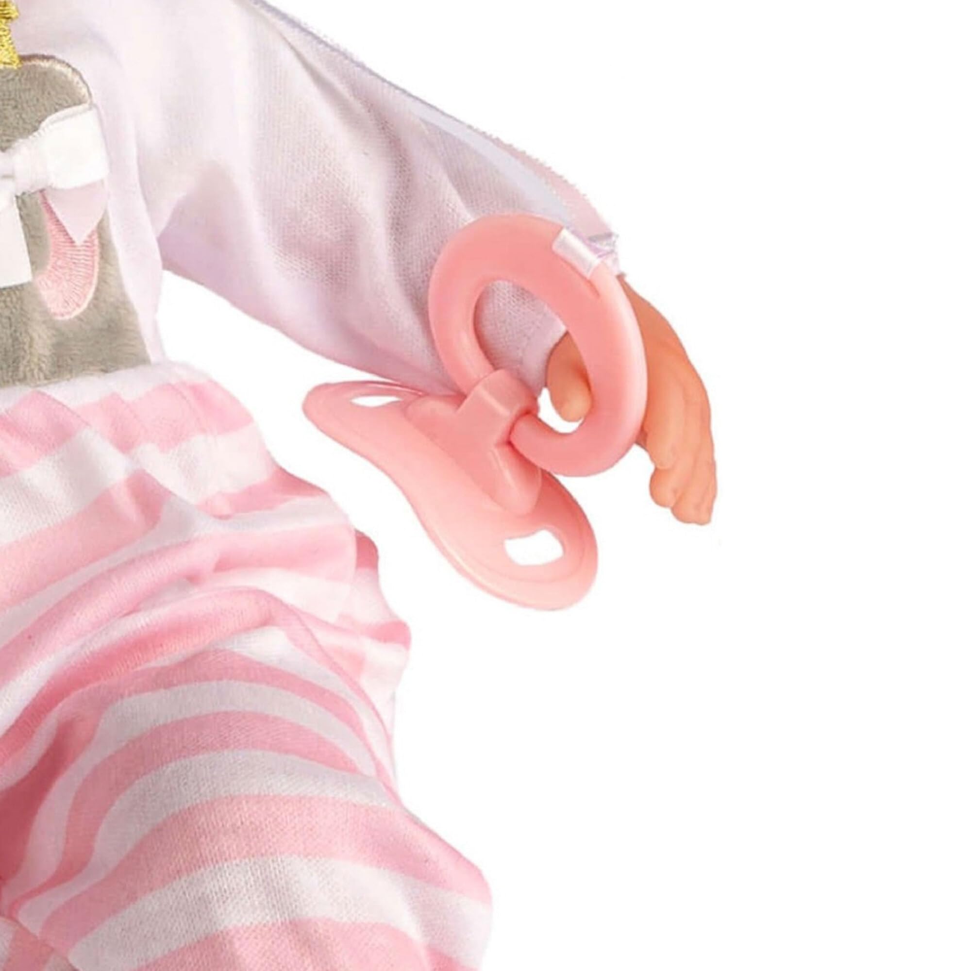 Berjusa accessories laid out including bottle pacifier rattle for feeding play