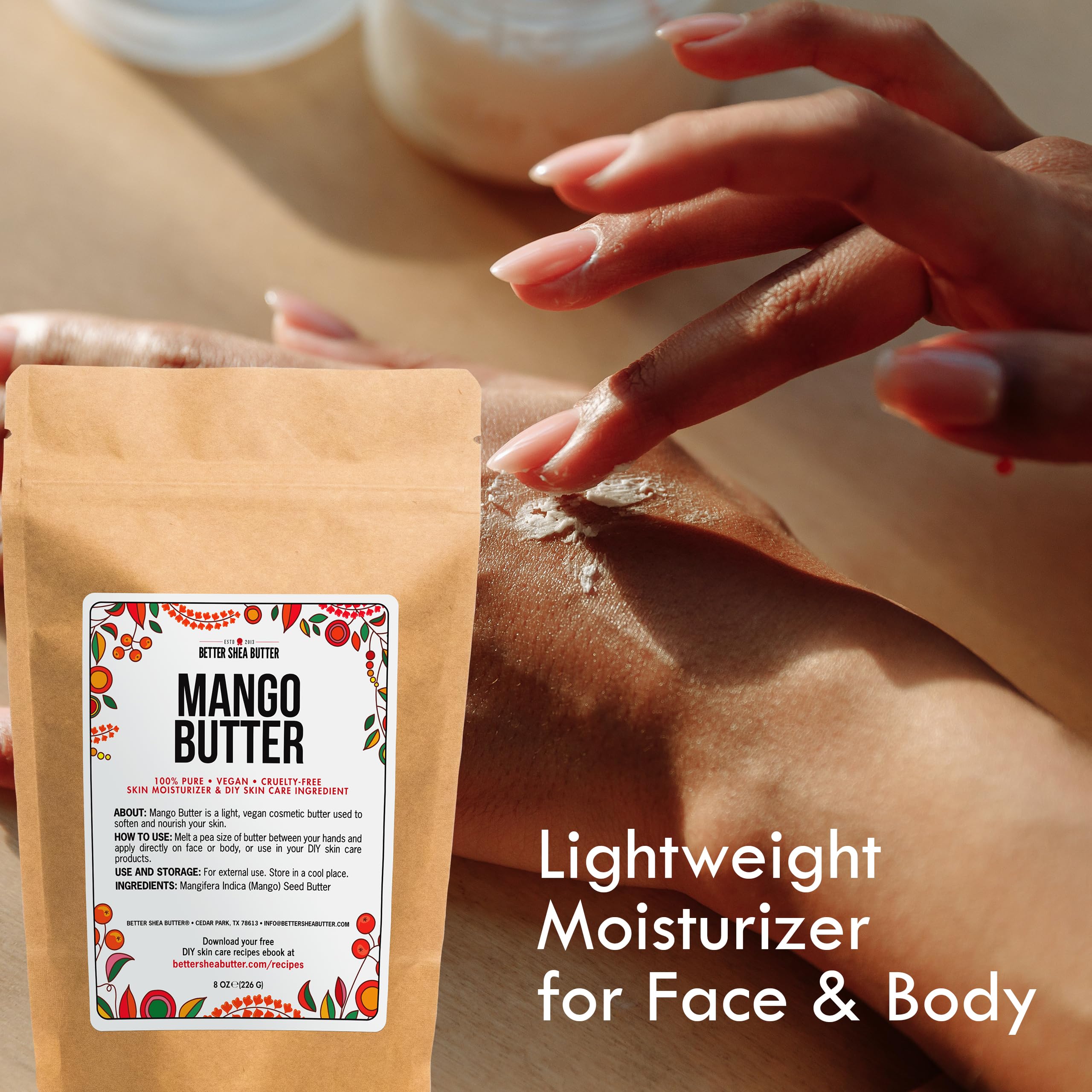 Better Shea Butter applying mango butter to hands for hair use showing moisture sealing benefit