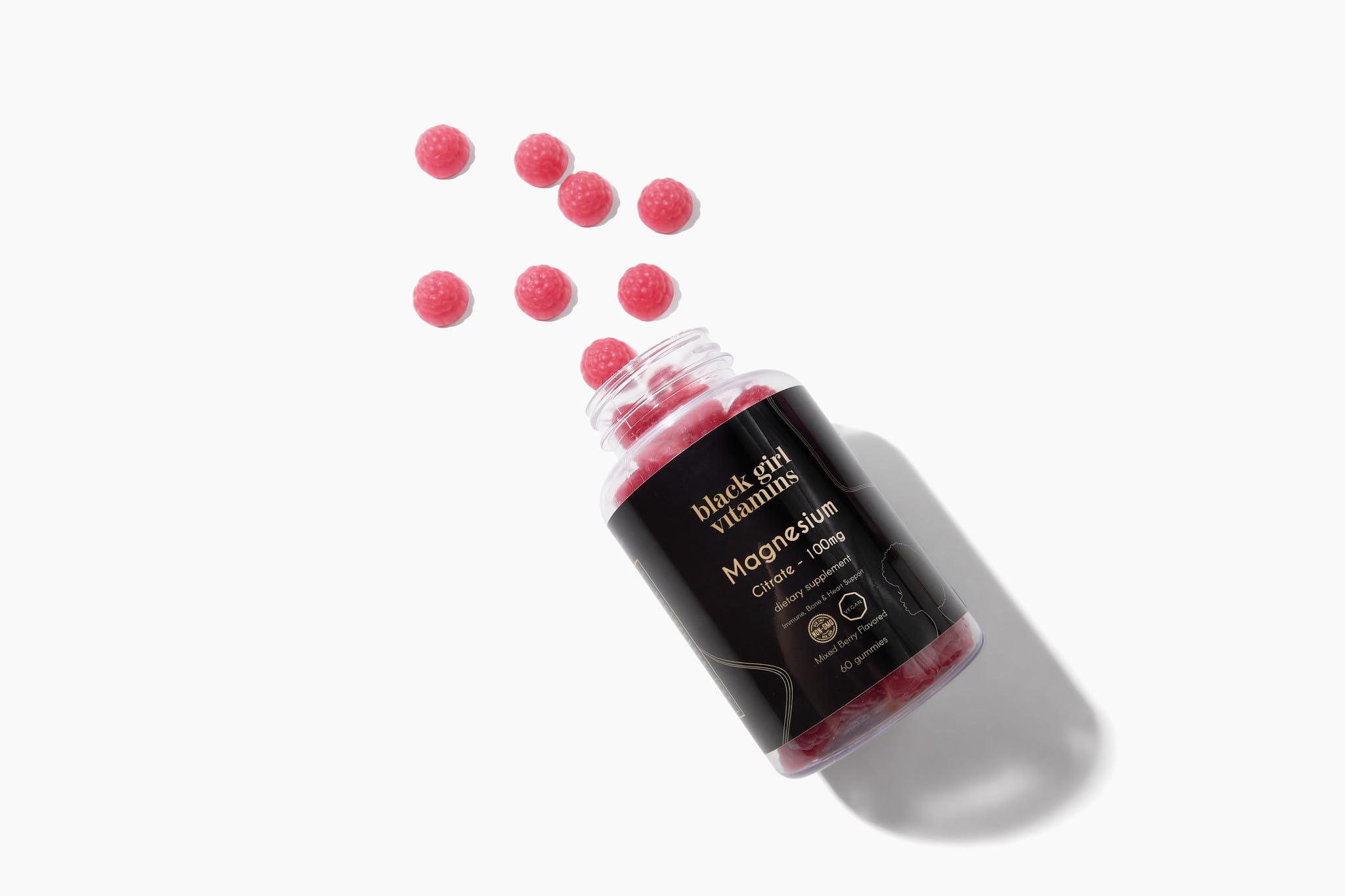 Black Girl Vitamins frasco en mesa de noche sugiriendo rutina nocturna