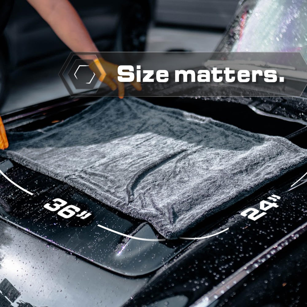 Blackline towel being used on car panel for streak-free drying