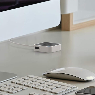 Blink Sync Module 2 placed on shelf with cameras showing centralized home monitoring