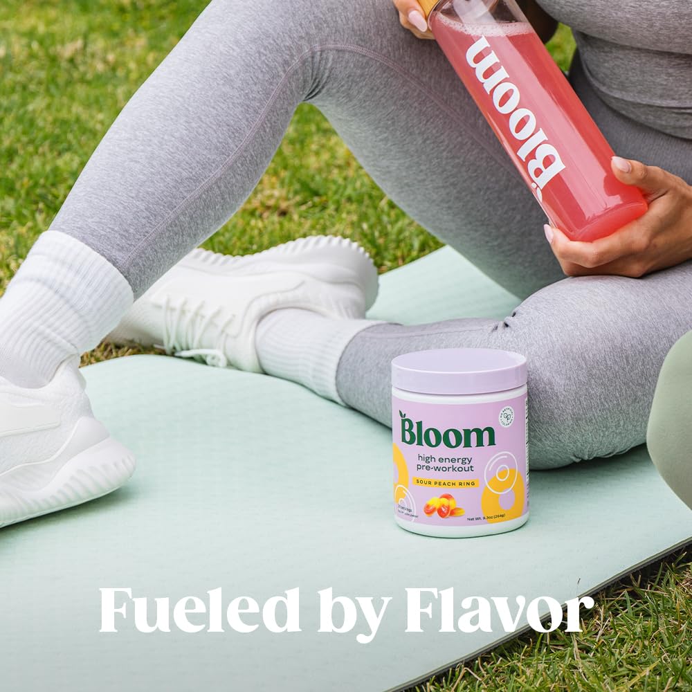 Bloom Nutrition tub beside gym gear in workout setting, boosts focus and endurance benefit