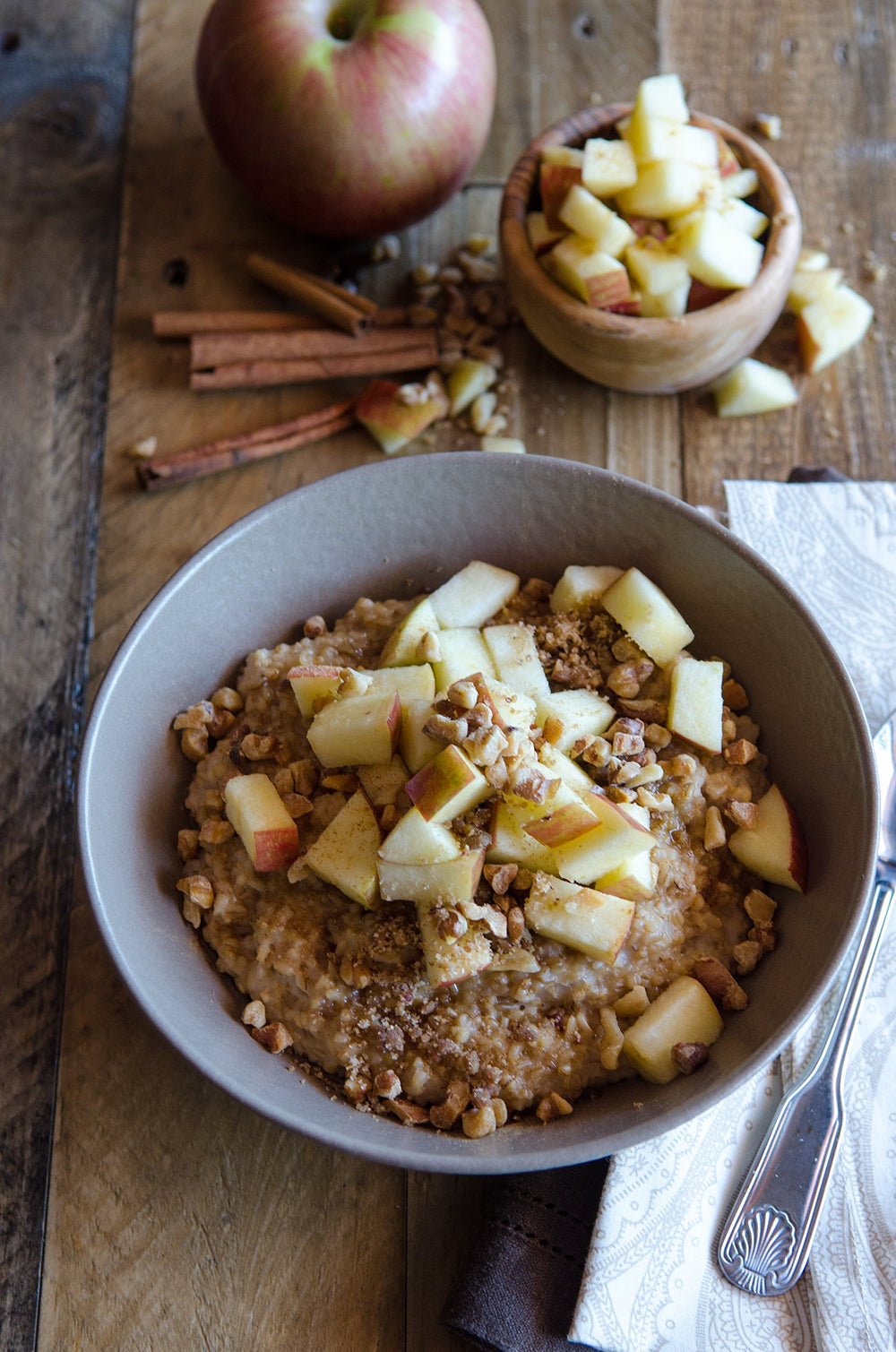 Bob's Red Mill cooked oatmeal in bowl topped with fruit displaying satisfying, customizable breakfast