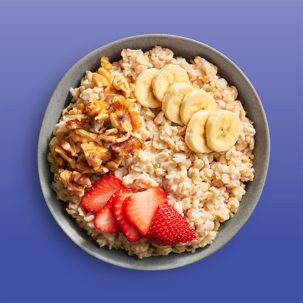 Bob's Red Mill oats served in a bowl with fruit, demonstrating a protein-rich breakfast