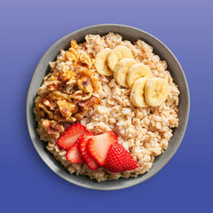 Bob's Red Mill oats served in a bowl with fruit, demonstrating a protein-rich breakfast