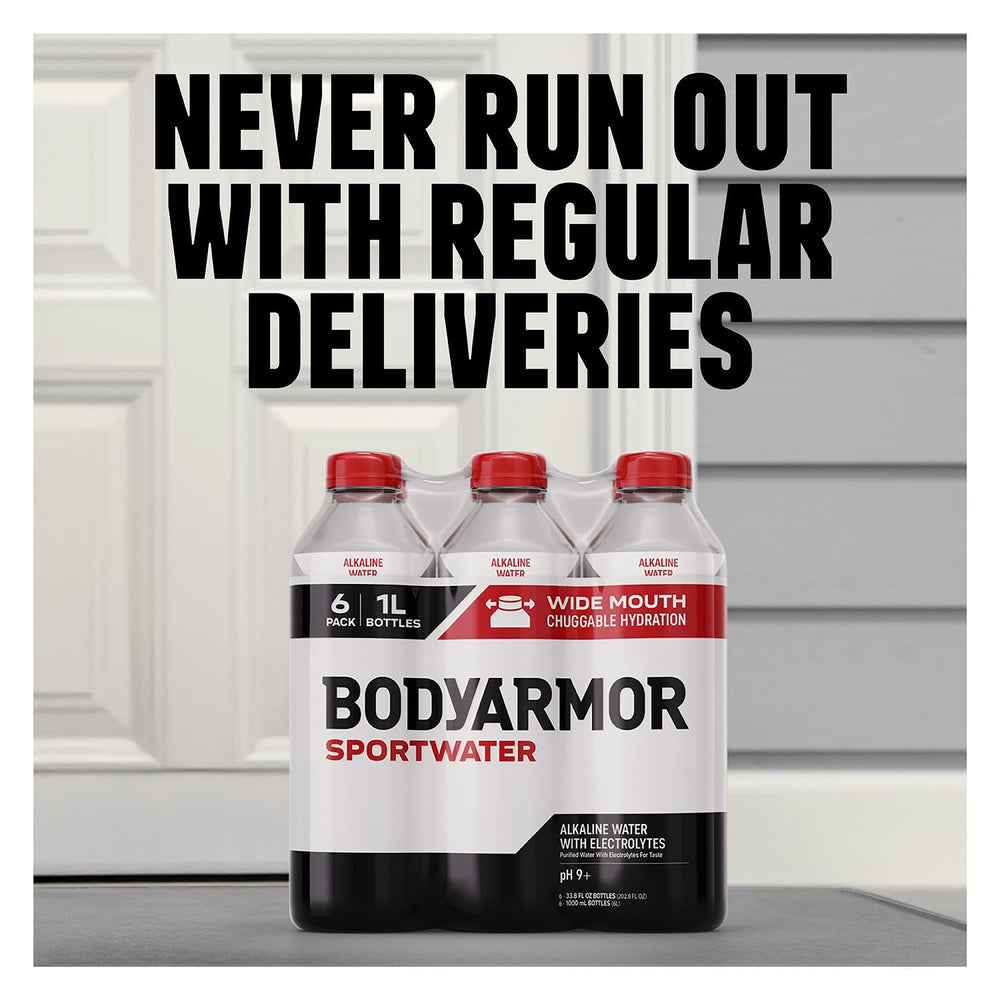 BODYARMOR SportWater held in hand to show 1L size and portable convenience