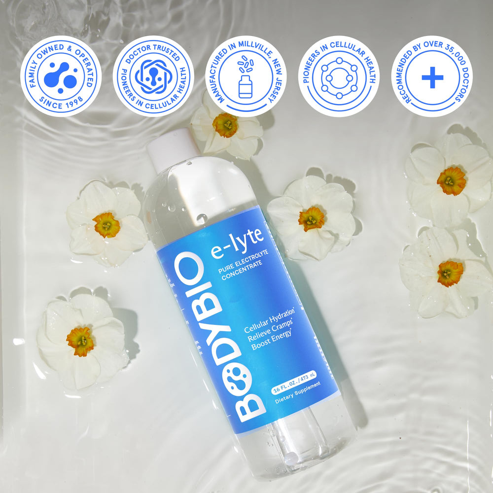 BodyBio e-Lyte bottle beside water bottle for convenient on-the-go hydration