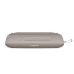 Bose SoundLink Flex hooked on backpack with secure utility loop