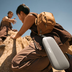 Bose SoundLink Flex held in hand showing compact portable size