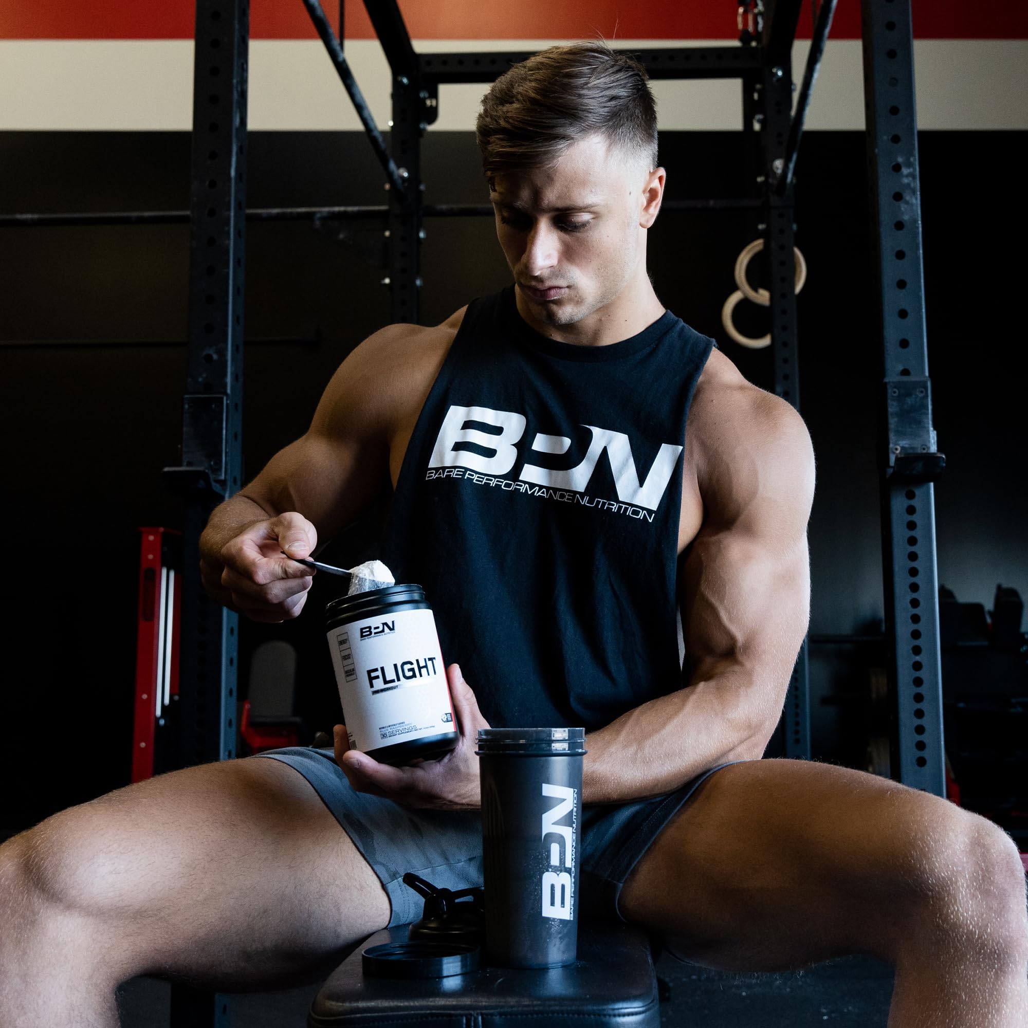 BARE PERFORMANCE NUTRITION tub beside banana for size and serving scale clarity