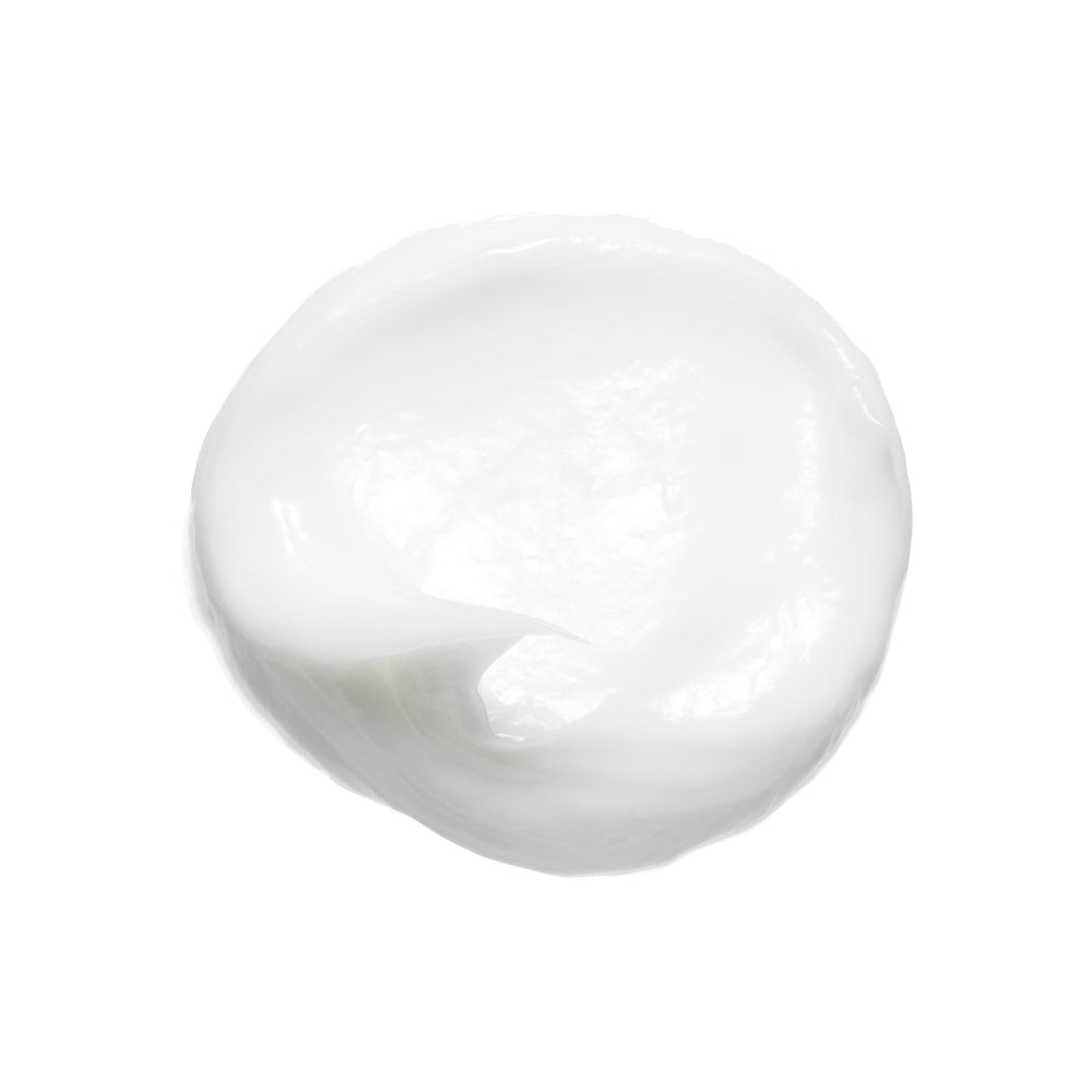 Bumble and bumble creamy texture swiped on hand displaying moisturizing slip