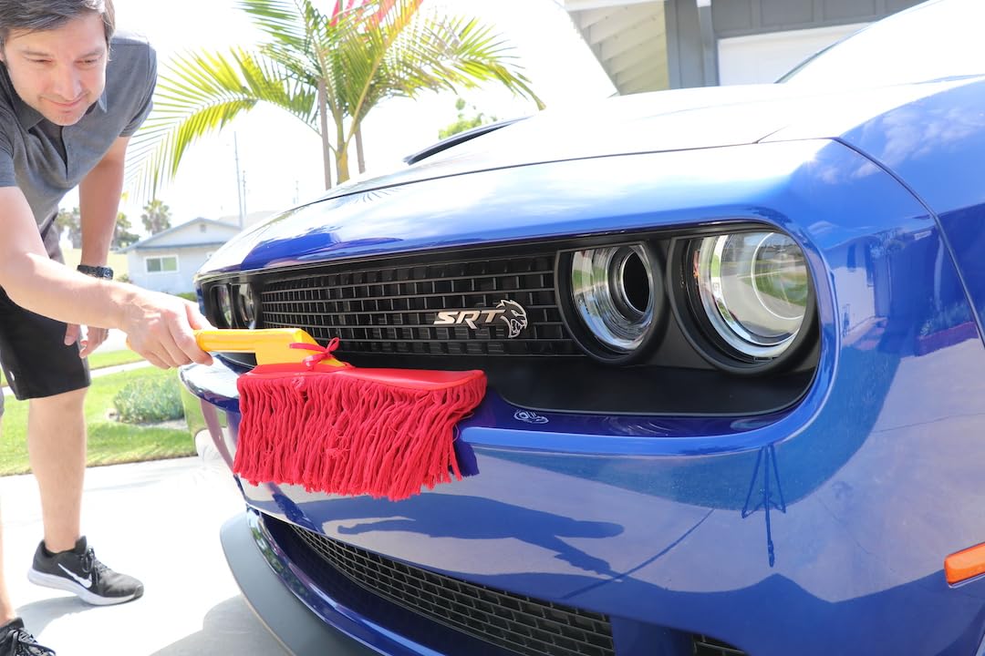 California Car Duster sweeping dust off car hood for quick maintenance
