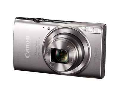 Canon PowerShot ELPH 360 HS held in hand in a street scene, demonstrating pocketable convenience