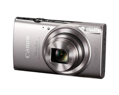 Canon PowerShot ELPH 360 HS held in hand in a street scene, demonstrating pocketable convenience