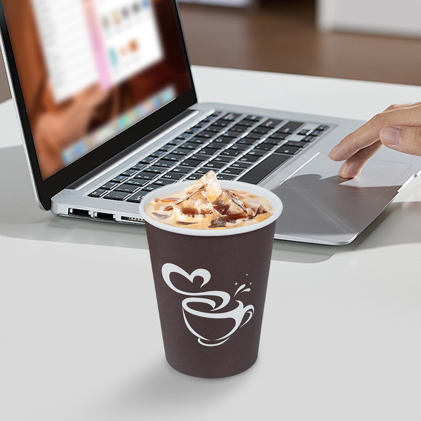 Clawsoff cup held in hand demonstrating 12 oz serving size