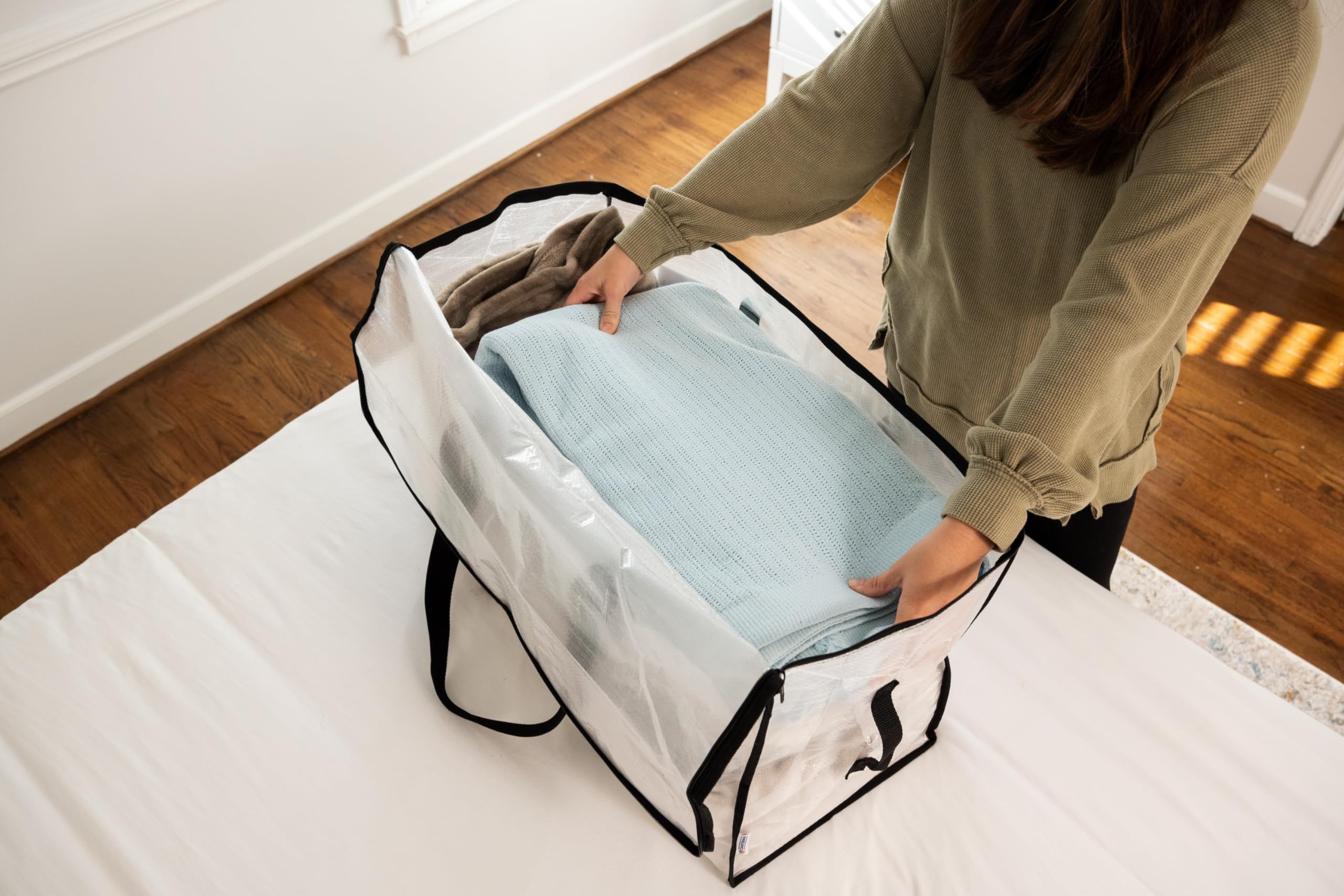 ClearSpace bag packed with folded clothing showing clear visibility and space efficiency