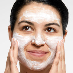 Clinique bottle beside sunscreen showing effective makeup and SPF removal