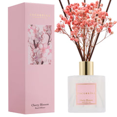 COCORRÍNA botella frontal con flor de cerezo y diseño elegante