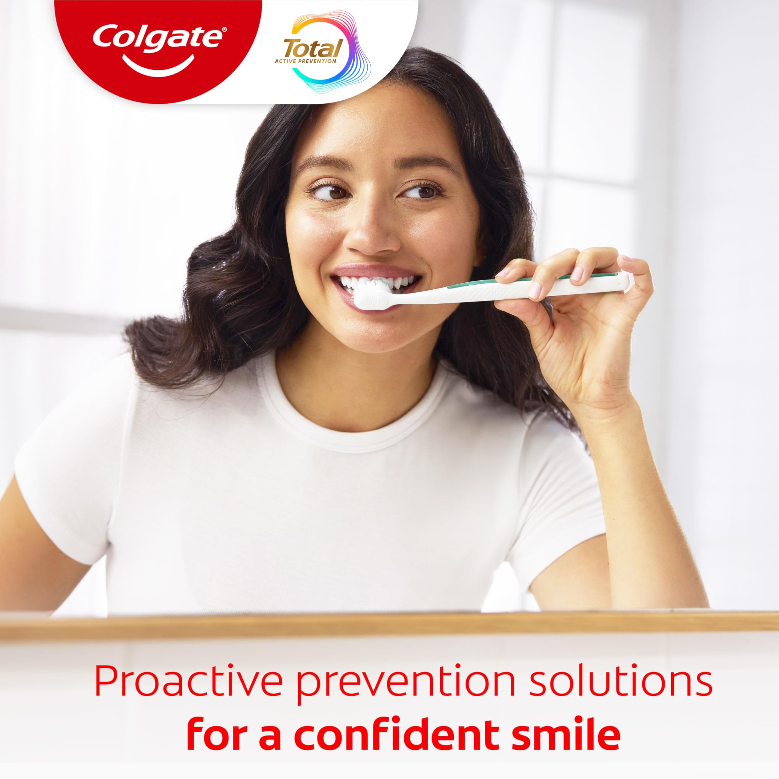Colgate Total tubo junto a una regla para comparar tamaño y duración