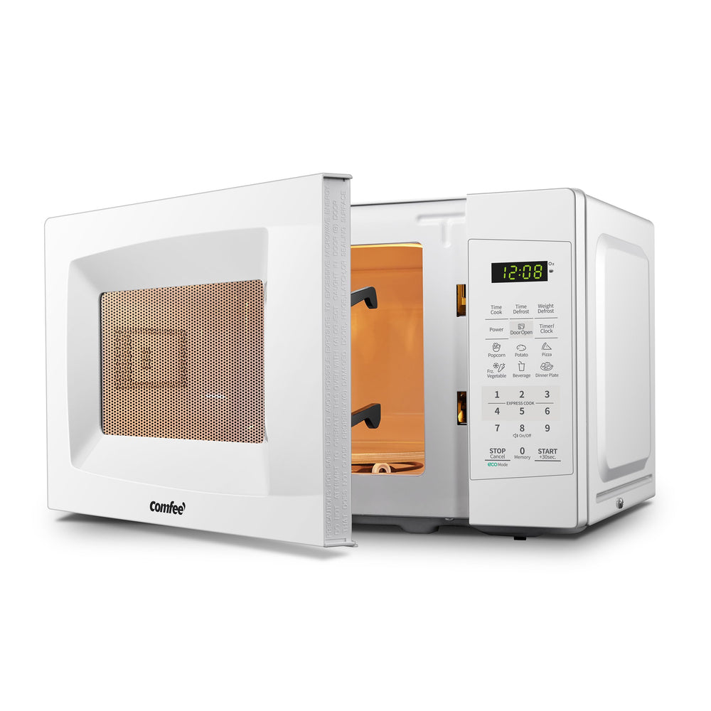 COMFEE' microwave with manual and accessories showing included components and setup ease