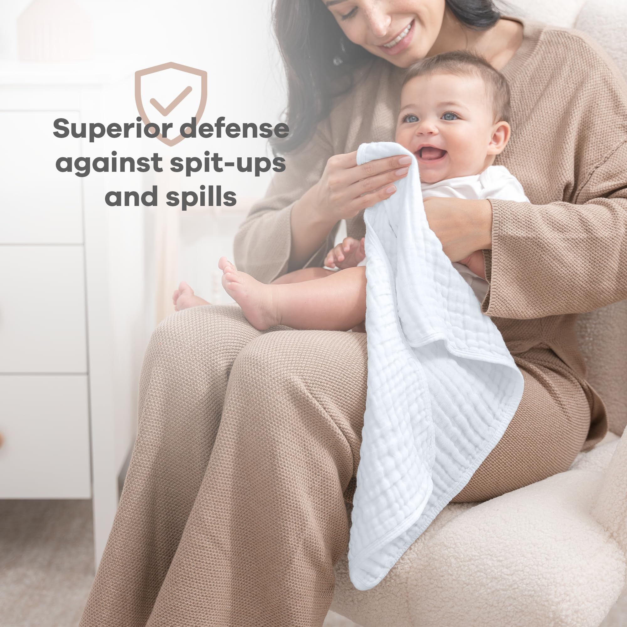 Comfy Cubs burp cloth in use on caregiver shoulder protecting clothing from spit-up