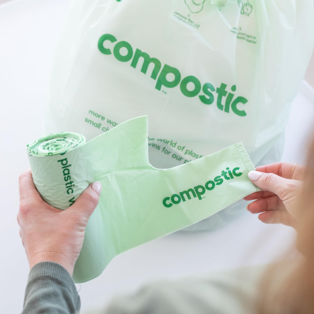 Compostic bag beside ruler to show 23x28 inch size and fit confirmation