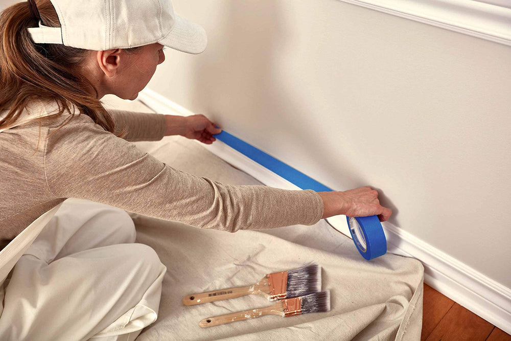 Corporate Hills drop cloth protecting hardwood floor during painting for clean results