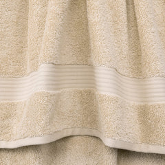 Cotton Paradise folded bath towel stack illustrating plush thickness and spa look
