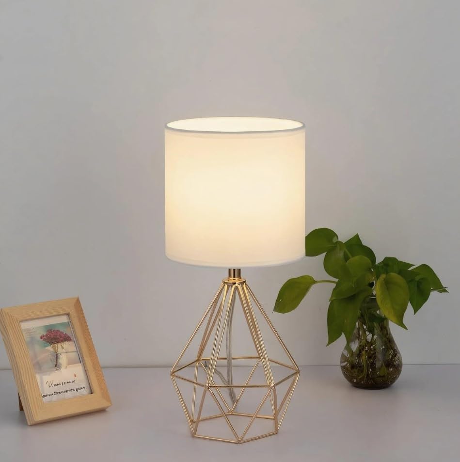 COTULIN gold lamp on a study desk providing focused task illumination