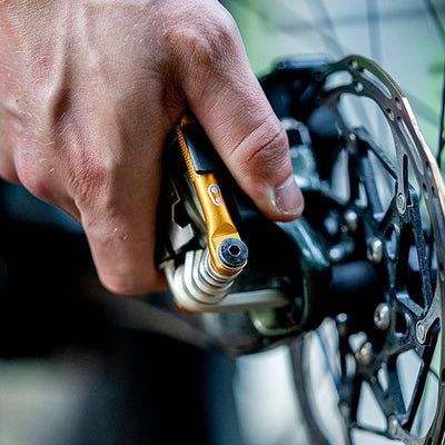 Crankbrothers M 19 beside a wallet to show its compact 89 mm scale portability