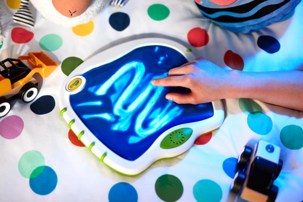 Crayola lifestyle scene with toddler playing and caregivers enjoying quiet time