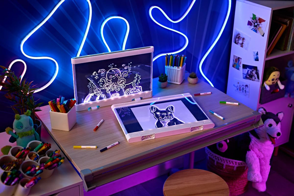 Crayola Ultimate Light Board with kickstand open beside a ruler to show size and portable design