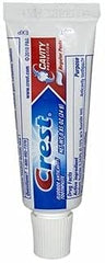 Crest travel tube in a toiletry bag demonstrating compact size and convenience for travel use