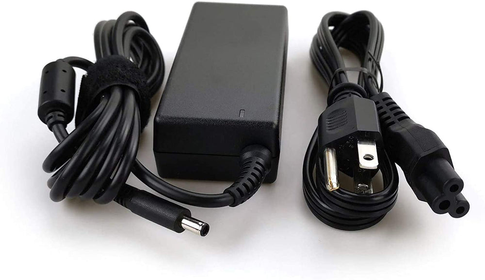 Dell adapter plugged into Inspiron laptop providing steady power during use