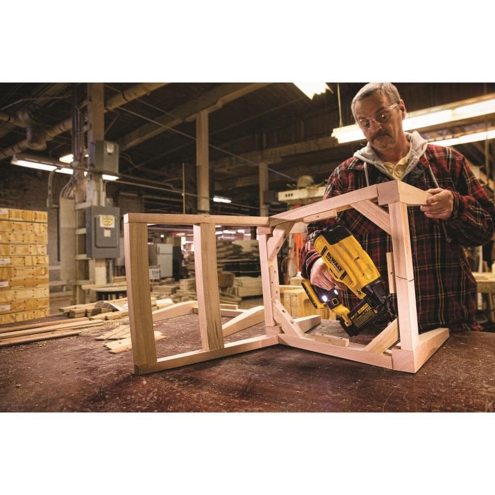 DEWALT brad nailer in use on molding showing cordless convenience and fast installation