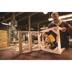 DEWALT brad nailer in use on molding showing cordless convenience and fast installation