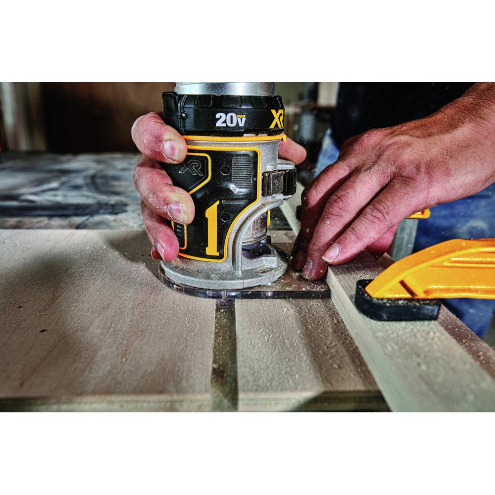 DEWALT router beside 20V battery for scale showing cordless convenience and portability