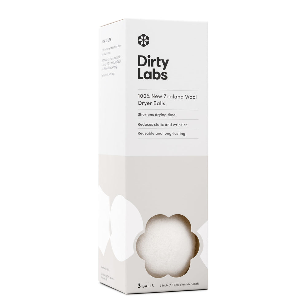 Dirty Labs paquete frontal mostrando las tres bolas y beneficio ecológico