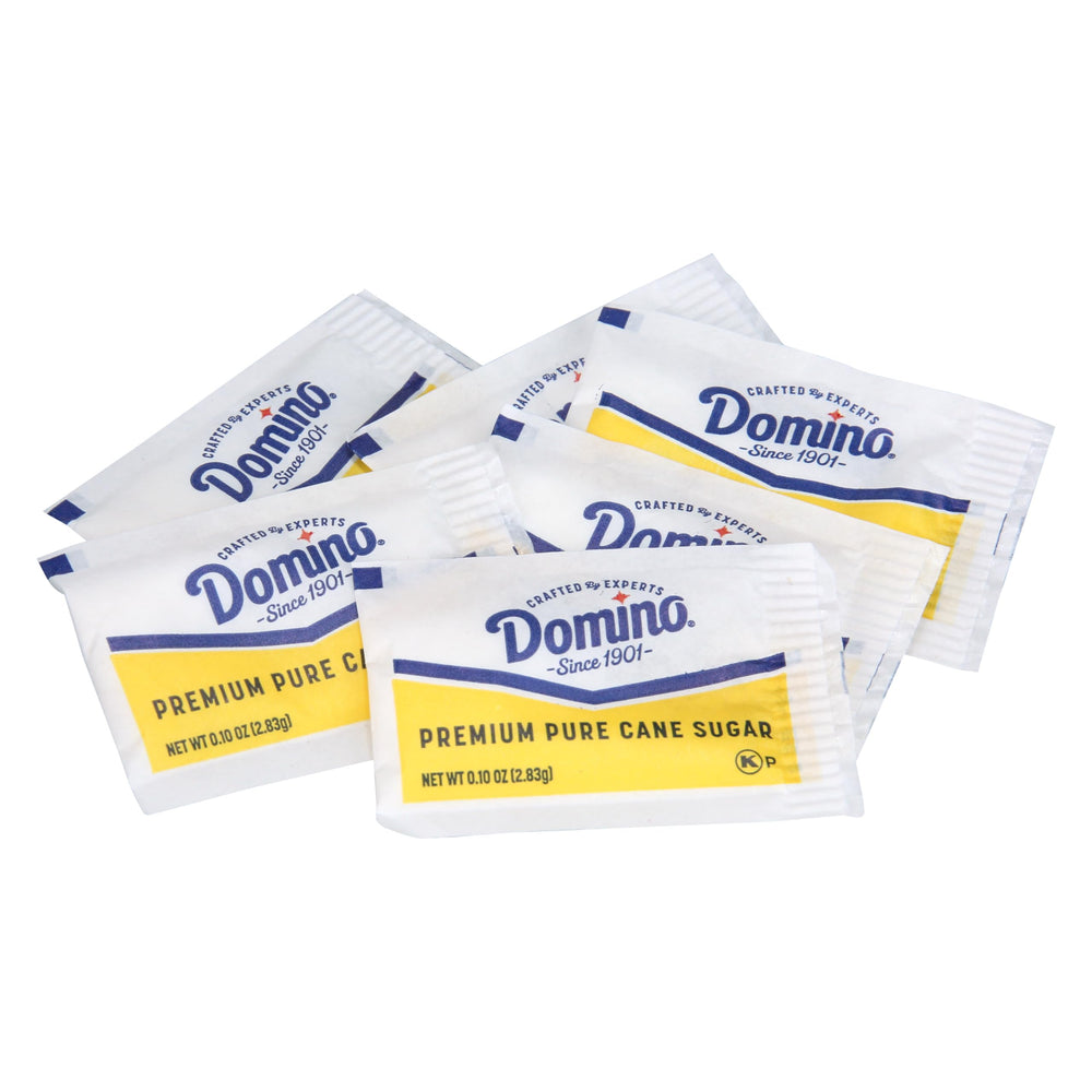 Domino sobre junto a una mano para mostrar escala, tamaño práctico por porción