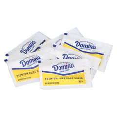 Domino sobre en dispensador facilitando acceso y servicio higiénico