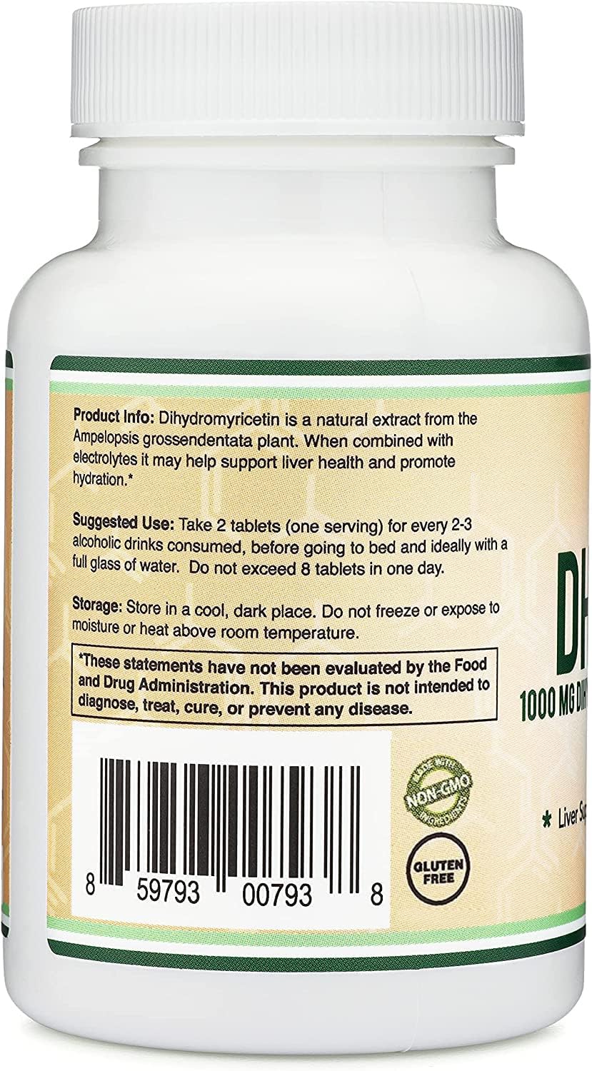 Hand holding a Double Wood DHM tablet to show scale and convenient single-dose format