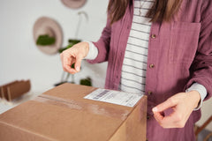 Duck HD tape sealing a cardboard box ensuring secure shipping and protection benefit
