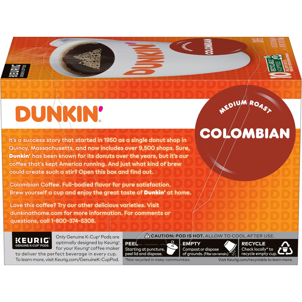 Hand holding a Dunkin' K-Cup pod to show size and single-serve convenience