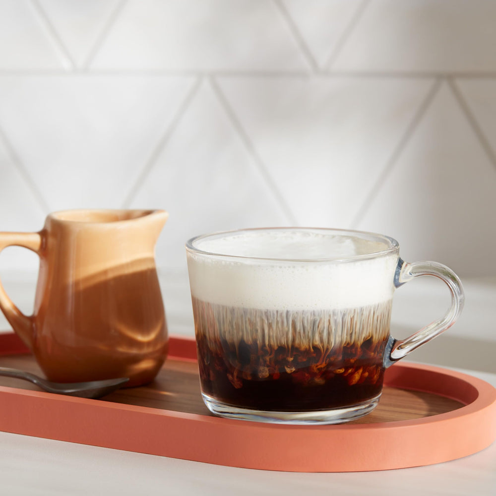 Six boxes of Dunkin' K-Cup pods stacked neatly for pantry organization