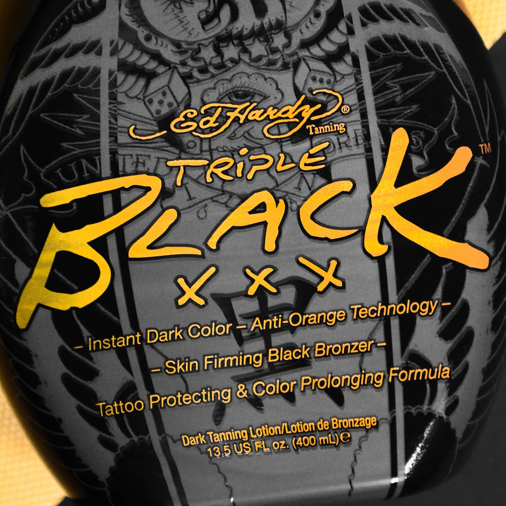 ED HARDY Black XXX junto a una mano para comparar tamaño y facilidad de uso