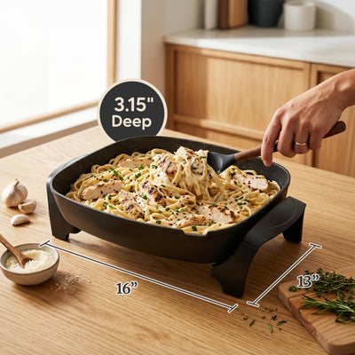 Elite Gourmet skillet open with pancakes cooking, showing large family capacity